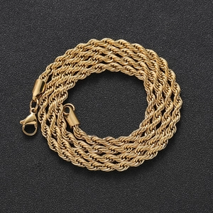 Polished golden stainless steel twist chain necklace with lobster clasp on black background