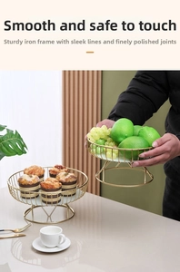 Detail showing smooth gold iron wire frame and white marble base of fruit tray