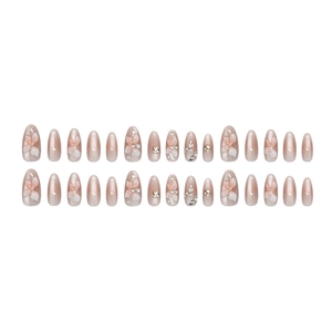 Pink gradient almond press-on nails with 3D white lily petals and luxury rhinestones