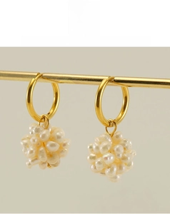 Detail of baroque pearl cluster earrings with 18k gold plated stainless steel hoops
