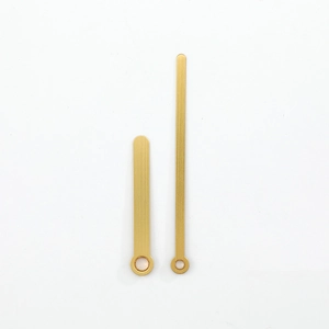 Minimalist golden brass clock hands with brushed texture finish, hour and minute set