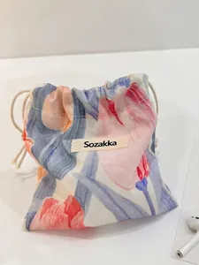 Japanese style drawstring makeup pouch with floral tulip patterns and cotton cord