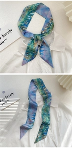 Impressionist oil painting style silk scarf tied as a bow on a white shirt collar