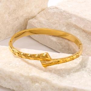 Modern 18K gold plated stainless steel bangle with classic Greek key geometric textures