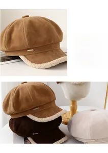 Detail of suede newsboy hat with fleece trim and metal logo in multiple colors