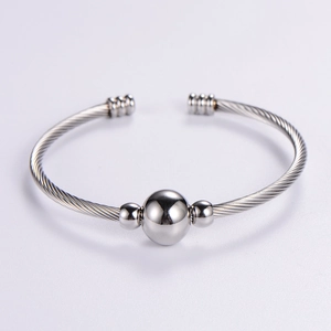 Silver adjustable stainless steel cable wire bracelet with polished center bead accent