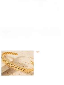 Detail of 18K gold plated stainless steel C-shape cuff with twisted rope texture