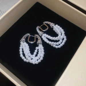 French style U-shaped pearl tassel earrings with zircon accents and silver metal finish