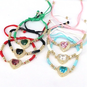 Detail of colorful woven heart bracelets with faceted crystals and adjustable cords