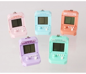 Close-up of five colorful mini arcade game console keychains in candy colors