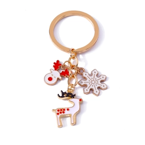 Christmas reindeer and snowflake keychain with red enamel charms on golden ring