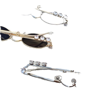 Vintage oval metal sunglasses with rhinestone accents and black lenses from multiple angles