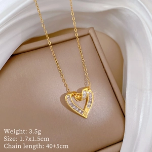 Detailed view of heart pendant with cubic zirconia inlay on beige silk lining