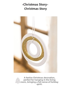Close-up of nested circular Christmas hanging ornament with golden glitter and white finish