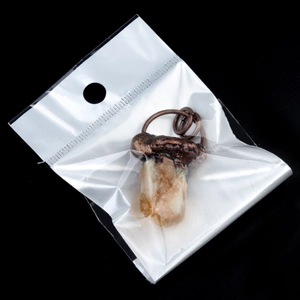 Vintage style natural yellow crystal pendant with bronze metal bail in clear packaging