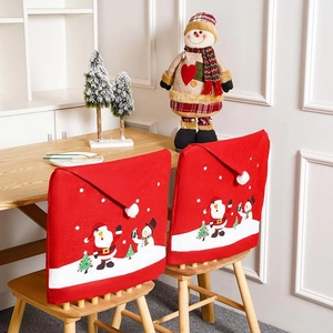 Christmas chair covers featuring Santa Claus and snowman patterns for holiday dining decor