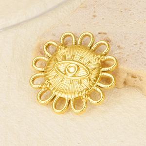 Macro view of gold-plated stainless steel evil eye pendant with sunburst detail