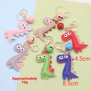 Macro shot of colorful PU leather dinosaur keychains with metal bells in six pastel colors