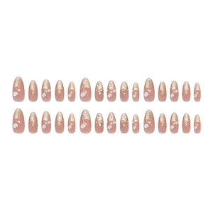 Pink almond press-on nails with gold glitter French tips and white flower designs