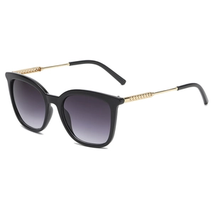 Retro oversized hollow metal sunglasses with black frames and golden woven temples