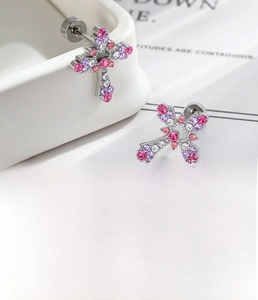 Detailed view of silver cross stud earrings with pink and purple zircon micro-inlay