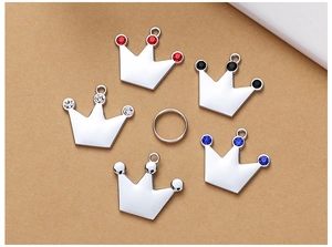 Detail view of zinc alloy crown charms with colorful rhinestones for pet collars