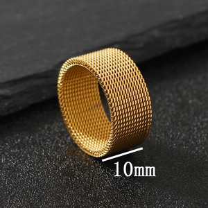 Macro shot of 10mm wide gold mesh ring with precise width markings on black stone