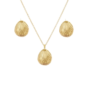 Detailed macro view of golden waterdrop earrings and necklace with spiral texture