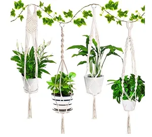 Detail view of four bohemian macrame plant hangers with different woven patterns