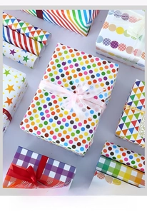 Various gift boxes wrapped in colorful dots stars and stripes patterned paper