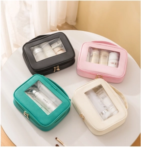 Set di quattro borse da toilette di lusso in vari colori con finestra in PVC trasparente