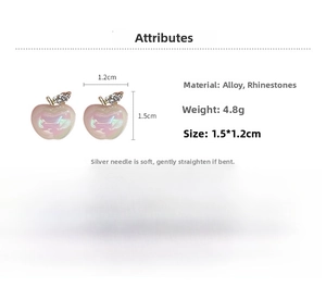 Close-up detail of pink rhinestone apple earrings with 1.5cm x 1.2cm size measurements