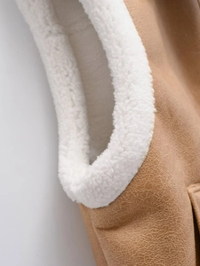 Close-up of khaki faux leather texture with soft white shearling lining detail