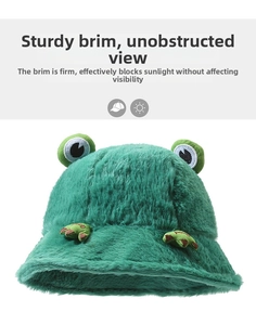 Close-up of green plush frog bucket hat showing soft fleece texture and sturdy brim
