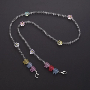 Detail of colorful flower and bear acrylic beads with metal lobster clasps for phone straps