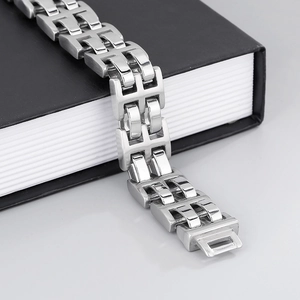 Macro shot of polished silver H-link stainless steel watchband style bracelet for men
