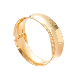 Minimalist wide golden metal bangle with high polish finish and spring hinge closure