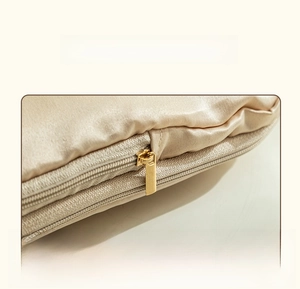 Detail of hidden zipper on champagne gold satin luggage organizer with smooth texture