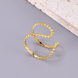 Elegant gold-tone stainless steel open ring with a textured bead design on a stone base