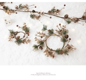 Close-up of luxury Christmas wreath with gold pine cones and shimmering berries decor