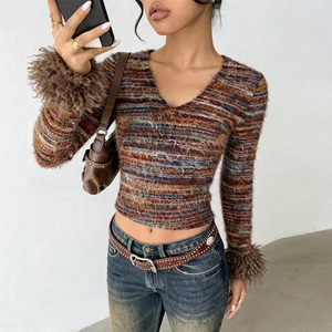 Detail of V-neck crop top with colorful stripes and brown faux fur cuffs for women
