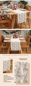Close-up of cream velvet Christmas table runner with festive gold sequin tree patterns
