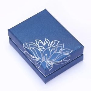 Blue rectangular jewelry gift box with silver lotus pattern and fine woven texture