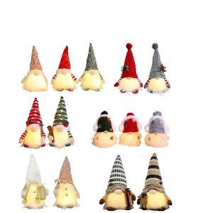 Group display of Christmas sequin glowing gnomes with warm LED lighting features