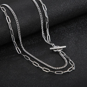 Close-up of double-layer silver stainless steel chain necklace with minimalist OT buckle