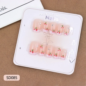 Pink French style press-on nails set with cute cherry designs and small rhinestones