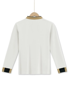 Close-up of off-white waffle polo shirt with plaid trim details on collar and cuffs