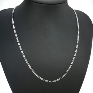 Polished silver stainless steel Cuban link necklace on a professional black bust mannequin