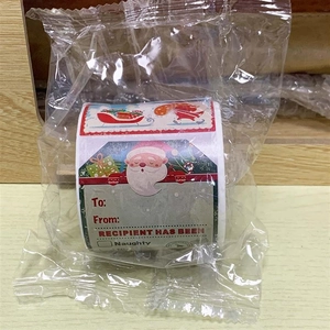 Roll of 200 Christmas gift label stickers with Santa Claus design in plastic packaging