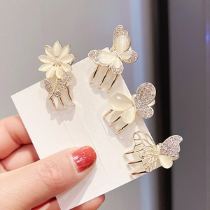 Set of four mini gold butterfly and flower hair clips with opal stones and crystals